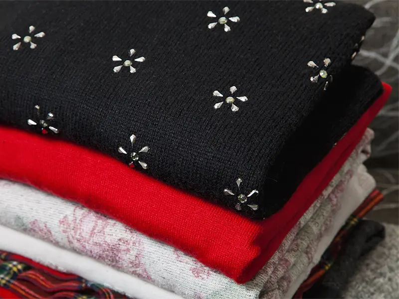 Stack of clothing after textile restoration services